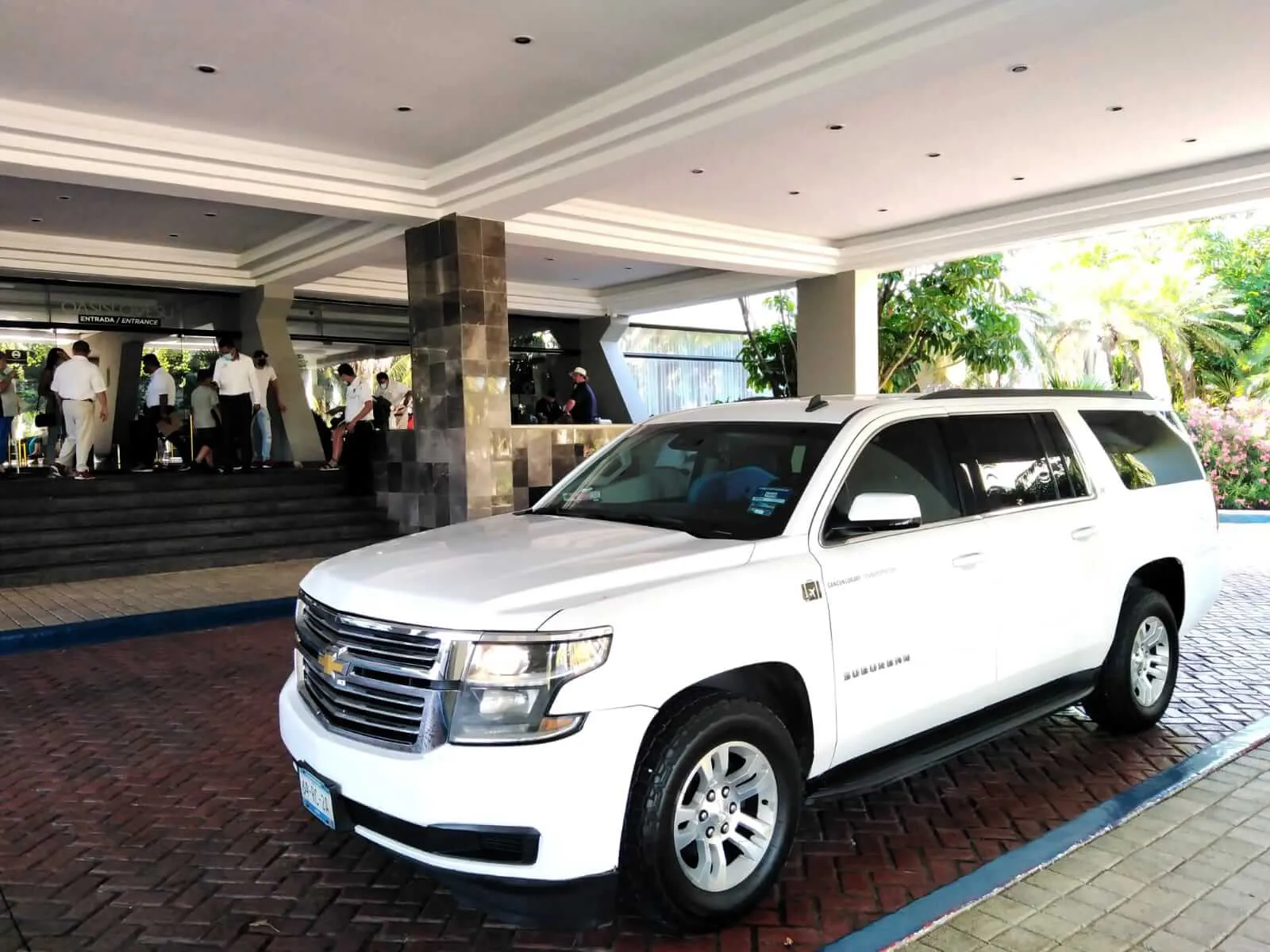 Luxury black SUV with Mayan pyramid in the background