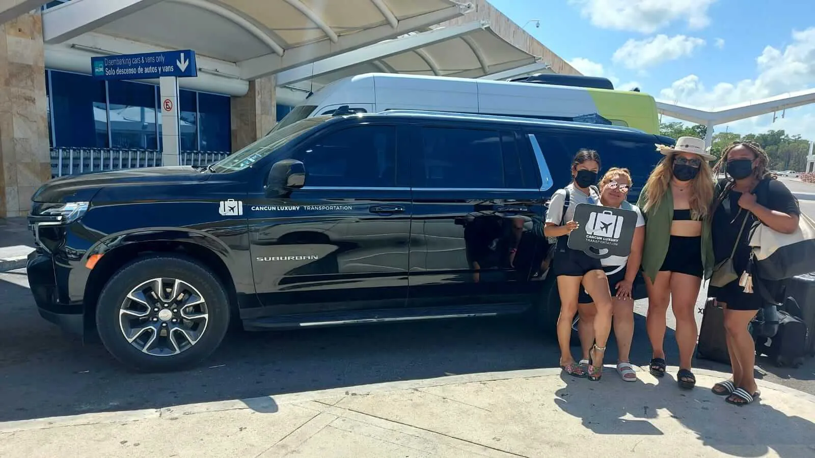 Group of 4 women arriving at Cancun Airport by luxury transportation