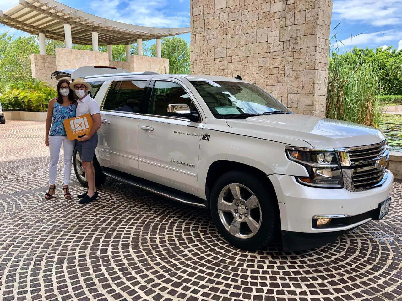 Couple arriving to their accommodation after a Luxury Service